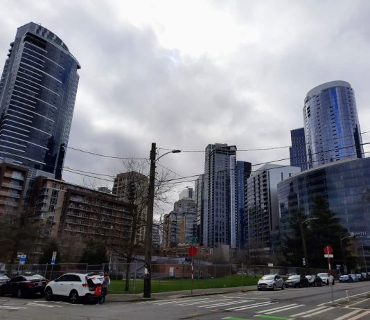 Harrell Changes Course Again Backs ‘Shifted North’ Denny Station Looking towards the stations site clustered near the Denny and Westlake intersection with shiny highrises on all sides.