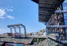 Good Urbanism, not Event Surges and Quick Fixes Will Spur Downtown Recovery The outfield bleachers at T Mobile Park with the skyline and blue skies in the background.