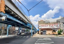 Take a Car Lane, Save a Transit Project Steel girders painted blue support the elevated rail line in Philly's Fishtown neighborhood.