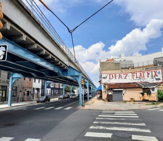 Take a Car Lane, Save a Transit Project Steel girders painted blue support the elevated rail line in Philly's Fishtown neighborhood.