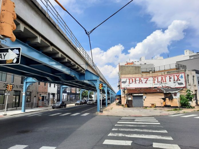 Steel girders painted blue support the elevated rail line in Philly's Fishtown neighborhood.