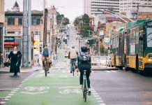 Seattle Lays Out 2030 Mode Shift Goals in Climate Framework People ride bikes along Broadway. The bustling business district in Capitol Hill blends bike lanes, pedestrian spaces, bus service, streetcar tracks, and vehicle traffic.