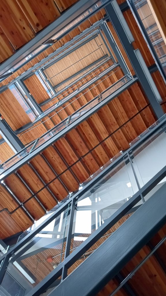 Looking up through the building's flights of wooden stairs.