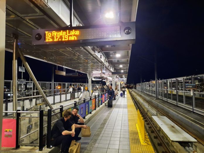 A dark light rail platform at SeaTac Airport during a service disruption.