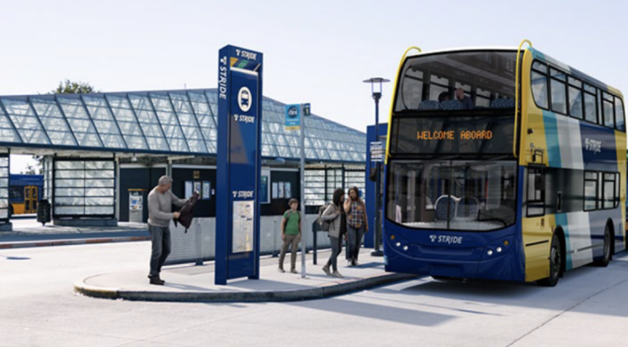 Sound Transit Selects Private Bus Operator for Stride BRT Network A double decker bus is rendered in Stride livery sitting at a bus station.
