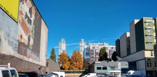 A parking lot in Belltown with towers behind