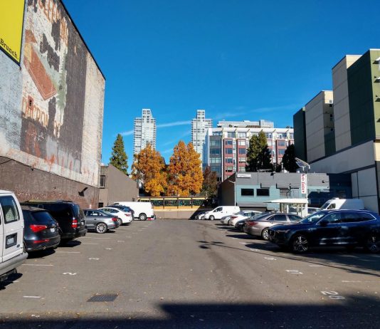 Washington State Senate Approves Sweeping Parking Reform Bill A parking lot in Belltown with towers behind