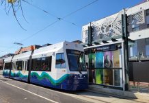 Tacoma Celebrates the Opening of the Hilltop Streetcar Extension Colorful photos on glass and geometric art stand out as a streetcar arrives at the Hilltop District T-Line station.