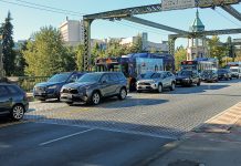 Seattle Council Pushes Forward on Transportation Impact Fees Cars line up on the Montlake Bridge.
