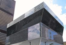 Seattle’s Public Libraries Chart a New Strategic Direction Seattle Central Library is a glassy modernist building that cantilever out at the top.
