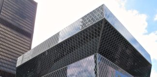 Seattle Central Library is a glassy modernist building that cantilever out at the top.