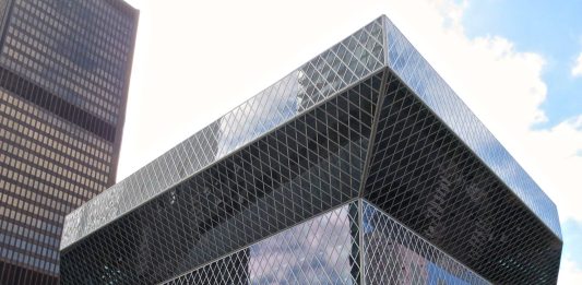 Seattle Central Library is a glassy modernist building that cantilever out at the top.