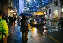 America’s Pessimism Isn’t Economic, Stupid – It’s Human  A rainy downtown Seattle street scene with bus 590 approaching.