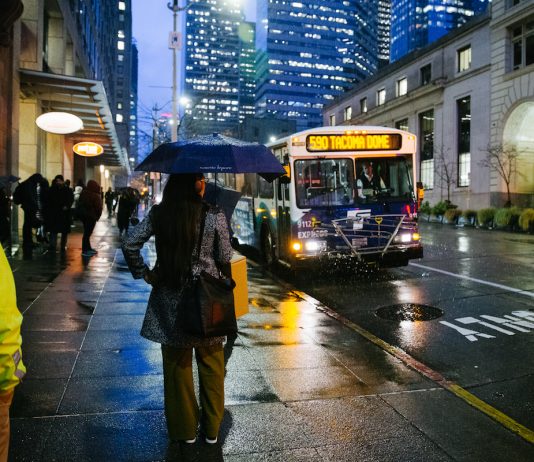 America’s Pessimism Isn’t Economic, Stupid – It’s Human A rainy downtown Seattle street scene with bus 590 approaching.