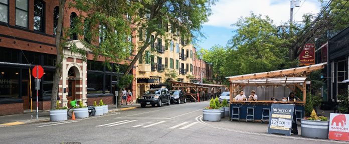 Old Ballard Avenue street view with street cafe seating.