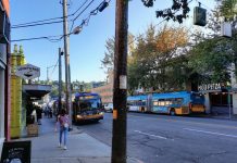Metro Seeing Early Signs of Labor Rebound and Ridership Momentum Two northbound buses line up outside Lucky Pho on Fremont Avenue with another southbound Route 62 across the street.