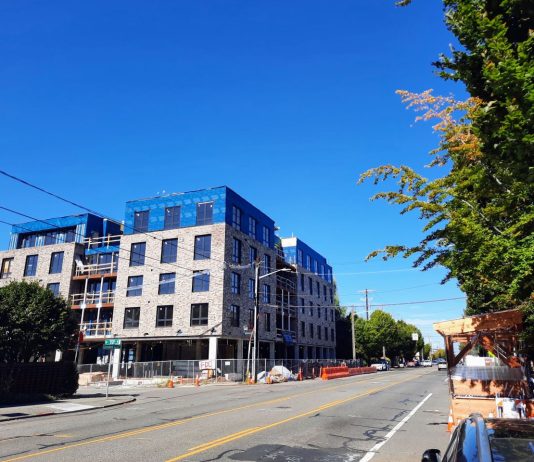 Harrell Delays Comprehensive Plan Release Again, Likely to 2024 A five-story mixed-use brick building under construction on Phinney Avenue.