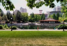 The Housing Crisis Isn’t Limited to Greater Seattle People stroll and jog in Waterfront Park with the Spokane skyline in the background.