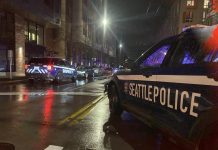 What to Look For in a New Seattle Police Contract Two SPD squad cars at a response scene