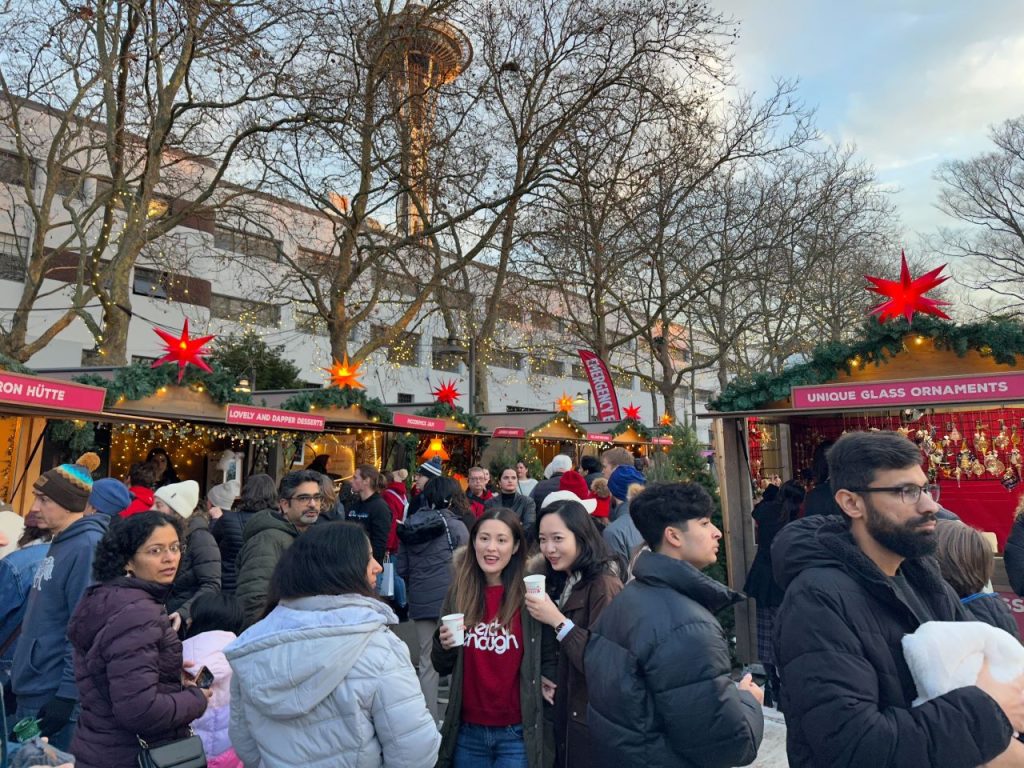 The Space Needle looms in the background, looking down on the rows of vendor stalls.