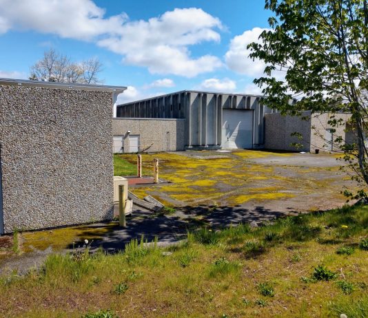 Fort Lawton Housing Project Faces a Make-or-Break Moment Fort Lawton include patchy grass and drab concrete low slung buildings and garages that used to serve the military installation.