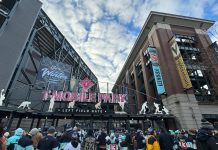 The NHL Winter Classic Can Accelerate Seattle’s Sonics Boom Entrance gate to T-Mobile Park with crowd going through ticketing, looking upward towards soft clouds and banners for Vegas and Seattle.