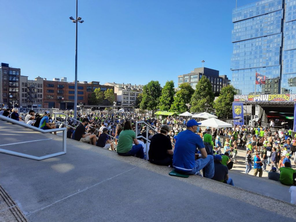 Soccer fans take in a concert during intermission between a Sounders and Reign doubleheader game.