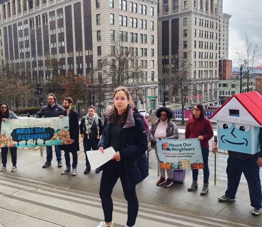 How Seattle Social Housing Advocates Campaigned to Victory Social housing advocates stand on the steps of Seattle City Hall with their house mascot.