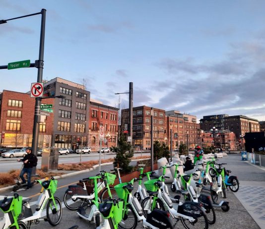 Bikeshare and Scootershare Booms in Seattle, with Lime Leading the Pack Dozens of vehicles stack up near the Colman Dock ferry terminal.