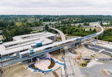 Lynnwood Link Light Rail Will Open August 30 A bird's eye view of an elevated station and parking garage.
