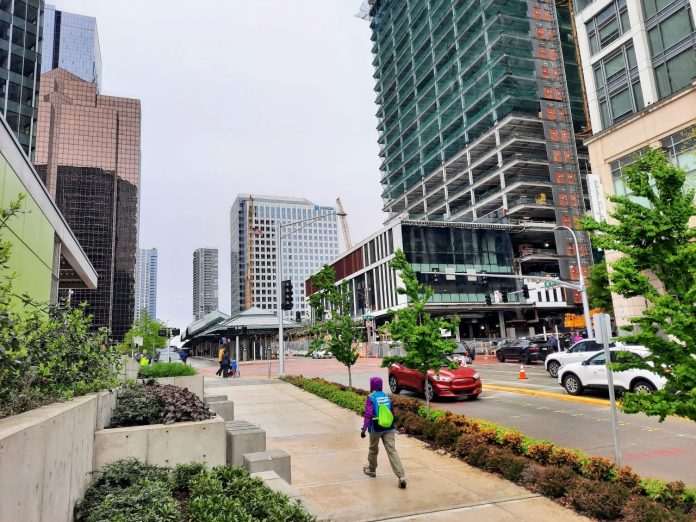 The Bellevue transit center is ringed by towers and a construction project adding another.