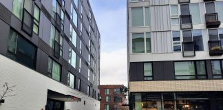 How King County’s Basic Income Program Could Fight Poverty and Increase Safety The courtyard at Midtown Square is surrounded by a 7-story apartment complex.