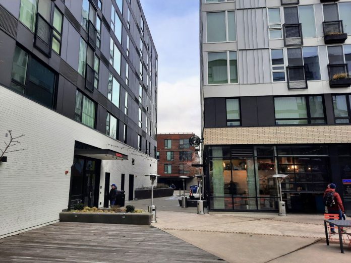 The courtyard at Midtown Square is surrounded by a 7-story apartment complex.