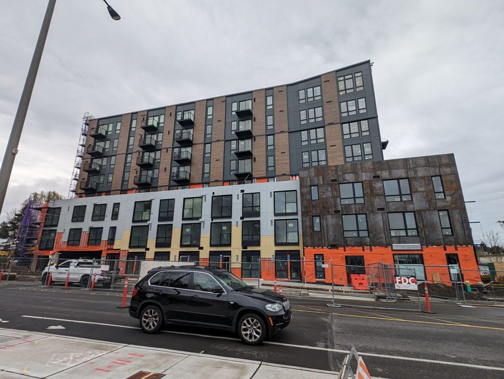 A new apartment building with its exterior nearly complete