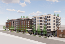 Two Seattle QFC Redevelopments Run Into Concerns Around Height and Parking A six story apartment rendered with white siding on the corners and brick in the middle.