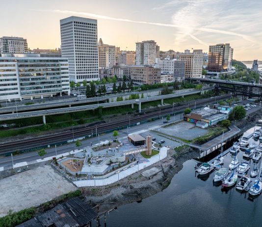 New Tacoma Waterfront Park Begs for I-705 Freeway Removal An aerial photo shows Tacoma's waterfront separated from its downtown towers by its elevated I-705 freeway.