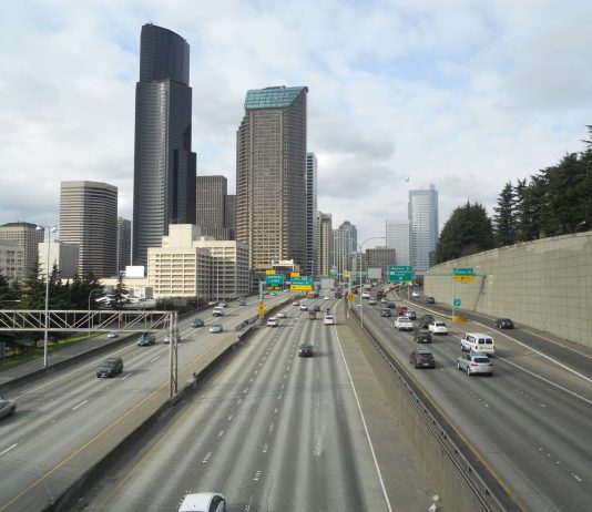 Op-Ed: Seattle Transportation Levy Should Seek to Undo Harm from Highways The Seattle skyline rises above the I-5 freeway trench in South Downtown.