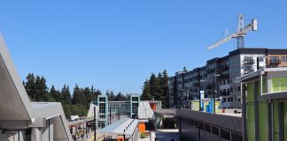 Shoreline North 185th Street station from the platform with an apartment building under construction