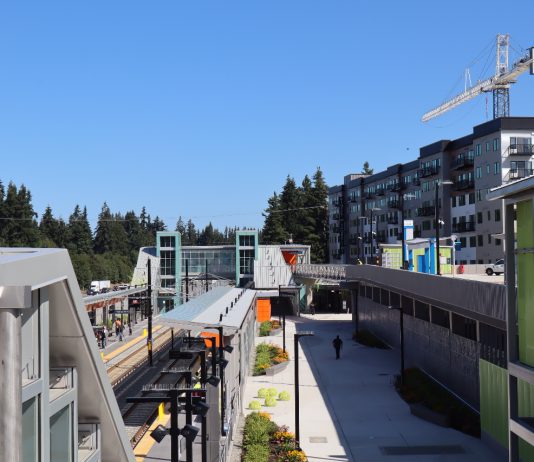 Shoreline Votes to Ditch Parking Mandates, Legalize Neighborhood Cafes and Stores Shoreline North 185th Street station from the platform with an apartment building under construction