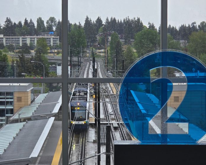 2 Line Train at Bellevue Downtown Station by Bryce Kolton 1200 A 2 icon decorates the mezzanine level overlooking the station platform with northern edge of downtown Bellevue in the background