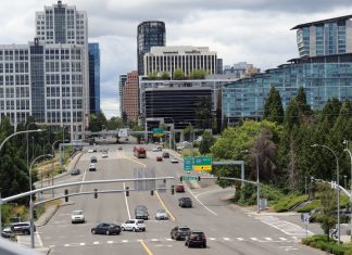 Op-Ed: Bellevue Can Lead the Region on Street Safety A high angle view of wide, car-choked 8th Avenue looking toward I-405 and the towers of Downtown Bellevue.