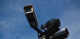 Two CCTV cameras mounted on a pole.