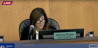 Rivera sits at the dais at council chambers.