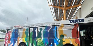 Week Without Driving Challenge Expands to 50 States from Seattle Launchpad The bus wrap ad shows silhouettes of people walking and rolling.