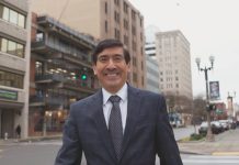 Op-Ed: Don’t Let Billionaires Buy Washington’s Supreme Court: Vote Mungia Mungia poses in a suit on a downtown Tacoma street.