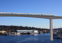 The Sound Transit Board Signals a Return to Parochialism A rendering shows a simple concrete bridge with a high span over Salmon Bay, with piers in the background.