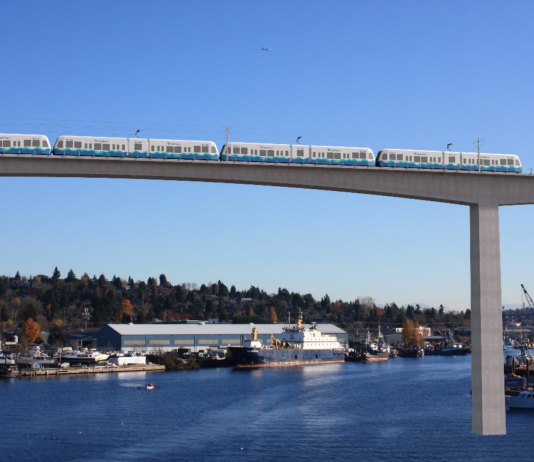 The Sound Transit Board Signals a Return to Parochialism A rendering shows a simple concrete bridge with a high span over Salmon Bay, with piers in the background.