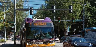 King County Metro Testing Onboard Cameras to Cite Bus-Lane Violators A Route 7 bus comes down Rainier Avenue on a sunny day in a red bus lane