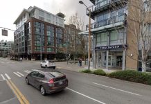 Reminder: The Urbanist’s Monthly Meetup Is Tuesday at TeKu Tavern The Space Needle peeks over the top of midrise rooftops