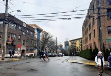 Seattle Reveals Midrise Zoning Proposal for Phase 2 of Growth Plan Pedestrians cross Denny Way at the Harvard Avenue intersection with midrise apartment buildings in the background.